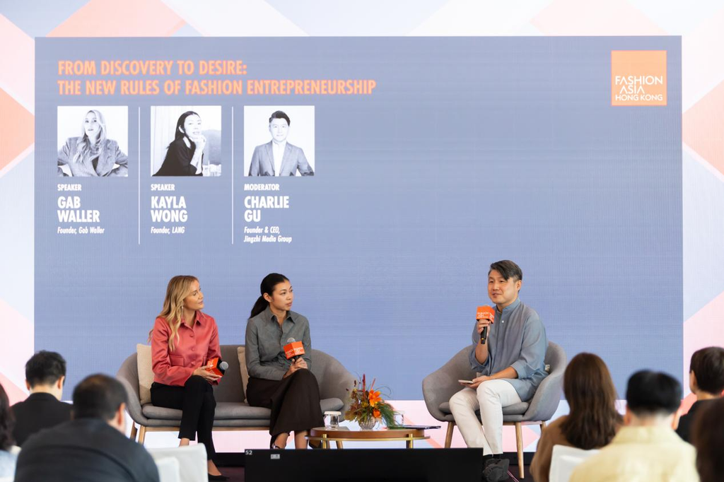 Charlie Gu from Jingzhi Media Group speaks with Kayla Wong and Gab Waller during the Fashion Challenges Forum 2026.