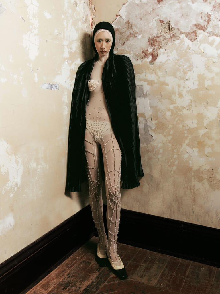 Runway look from Zhong Zixin SS23 “Madame Liu-Tsong” featuring structured Art Deco tailoring inspired by Anna May Wong