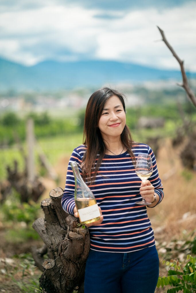 Mia sampling a glass of Chalu Snow Jasmine, a single-origin jasmine tea blend, on a tea estate in Yuanjiang, Yunnan.
